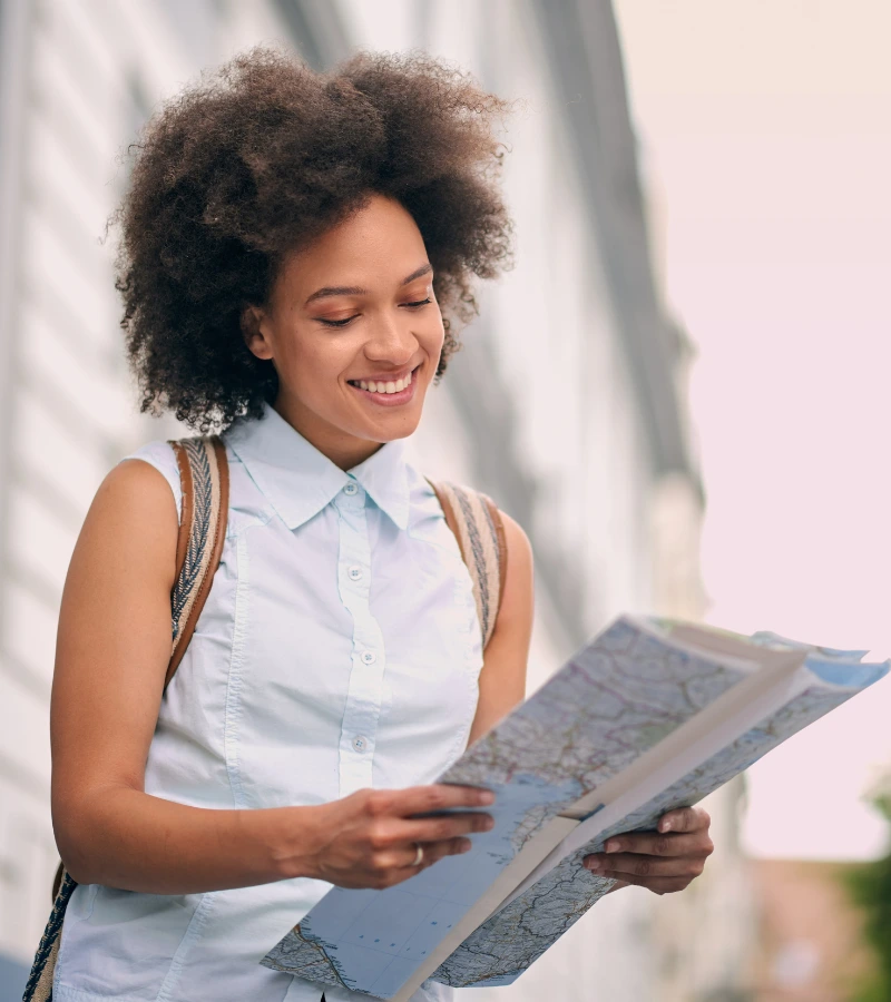 african american tourist looking at map