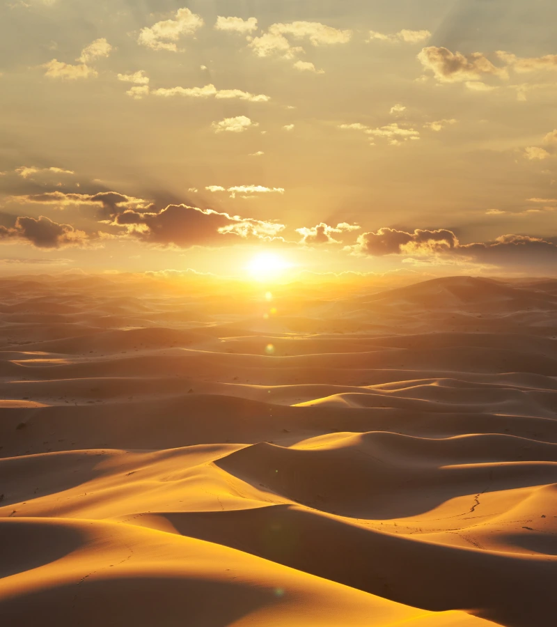 sun sets over desert, uae